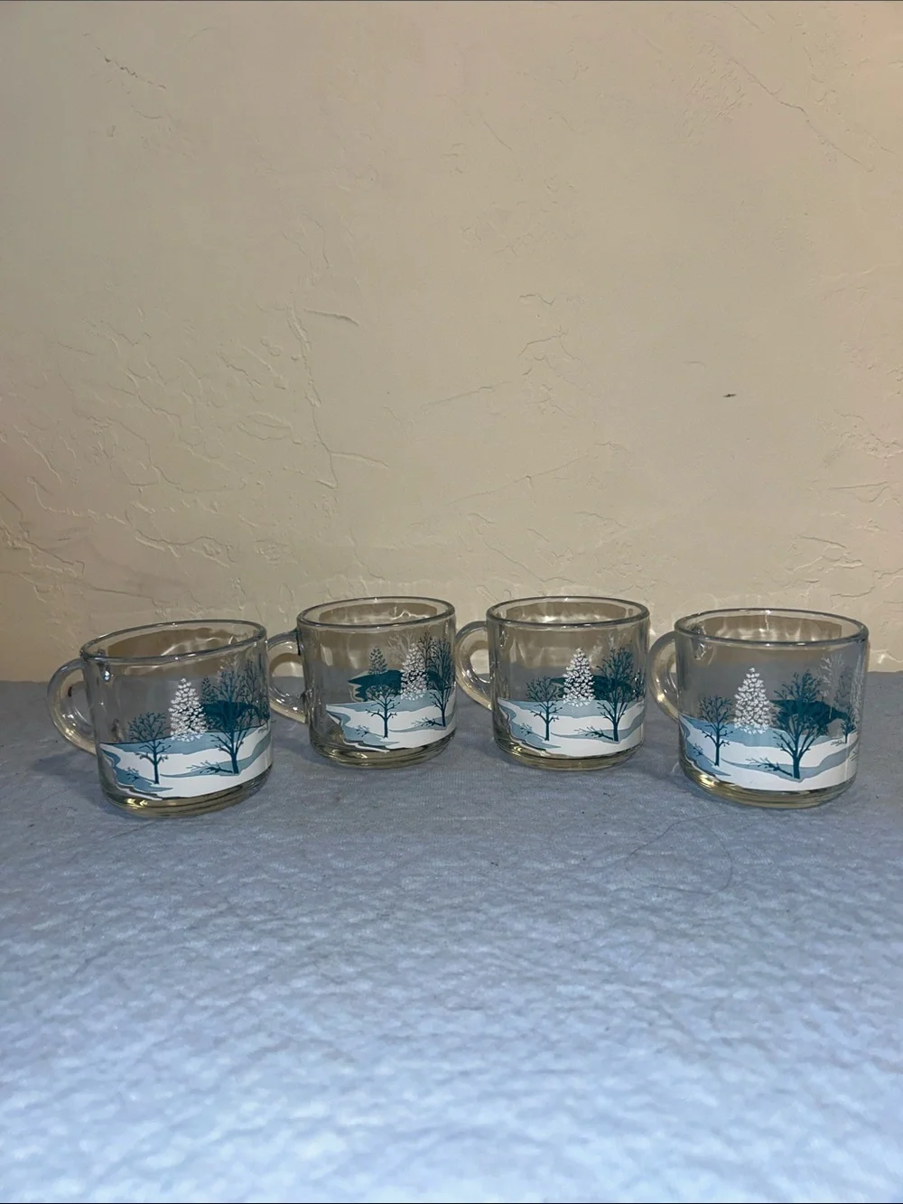 Set of 4Anchor Hocking clear glass coffee mugs featuring a blue-and-white winter